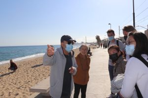 Making friends with locals during our beach walk in Barcelona